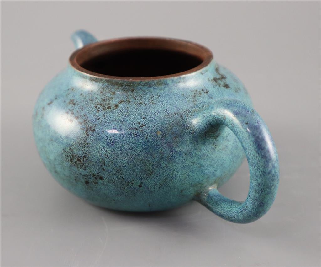 A Chinese Yixing robins-egg glazed compressed globular teapot and cover, Qing dynasty, 17.5cm across